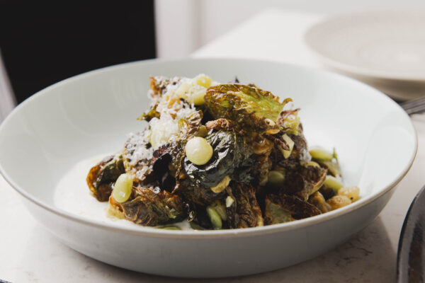 Fried Brussels sprouts, lima beans, golden raisins, cider vinaigrette, cardamom yogurt, lemon conserva, and sourdough bread.