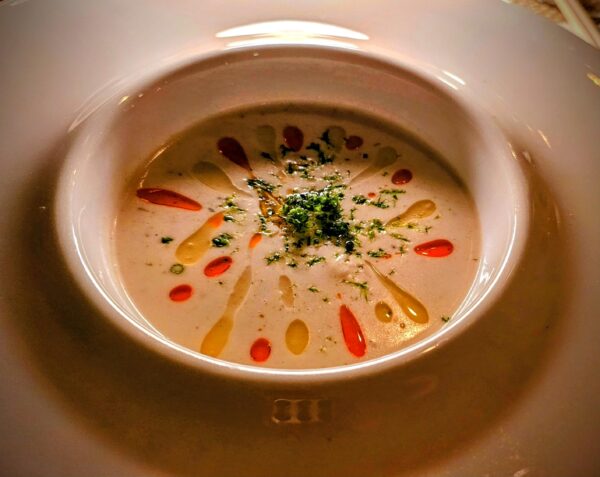Crab, Brie & Champagne Soup with lime, red chili, and curry- silky and creamy matched with Famille Fournier Longchamps Savennières 2019