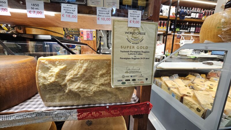 Wheel of local Parmigiano Reggiano cheese at the Mercato Storico Albinelli in Modena