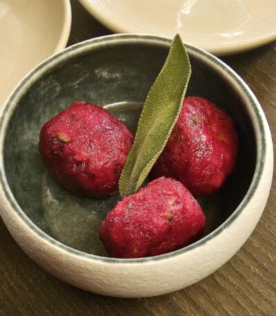 beetroot canederli (bread dumpling) served with butter, sage