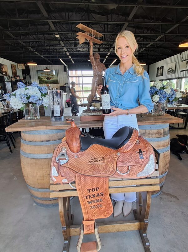 Meierstone Vineyards Owner Krystal Patel holds a Best of Texas award-winning wine